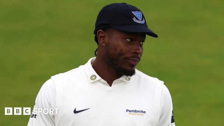 Jofra Archer looks on while playing for Sussex in the County Championship