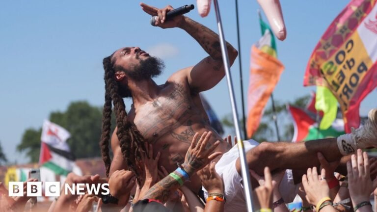 Police review footage of chants led by Glastonbury acts