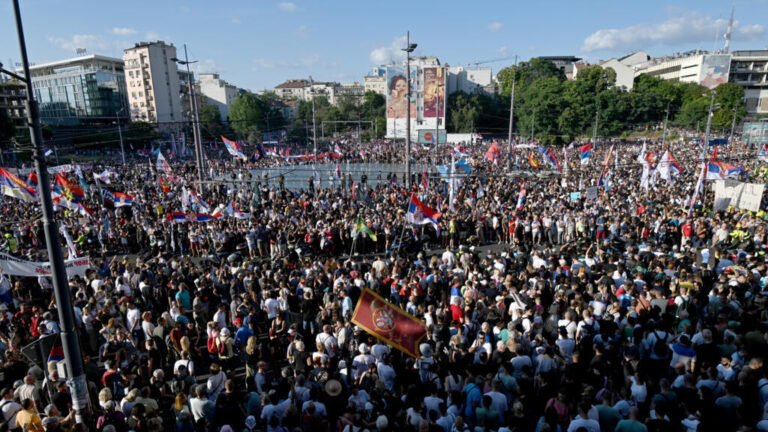 Tens of thousands rally in Serbia's capital to demand snap elections