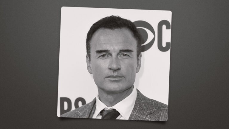 Julian McMahon on the red carpet in a black and white photo