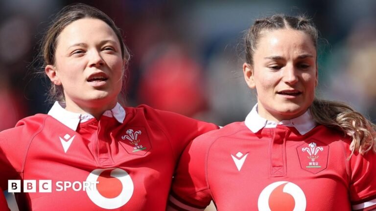 Alisha Joyce-Butchers and Jasmine Joyce-Butchers sing the national anthem side by side before a Wales game