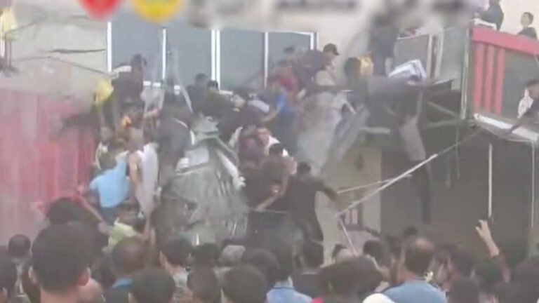 Balcony collapses as Palestinians scramble for aid in Gaza